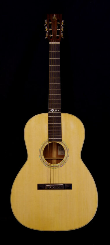 The 000 guitar, an acoustic guitar in the style of a 12-fret Martin 000