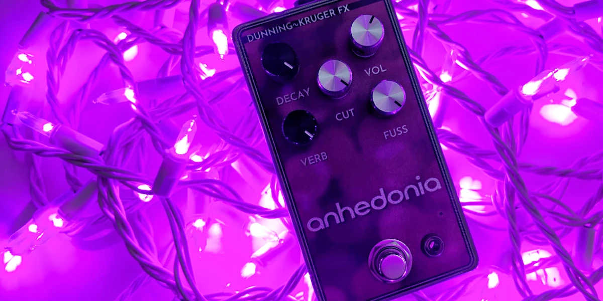 Anhedonia Pedal: Artsy high-contrast shot of the pedal on a pile of purple Christmas lights