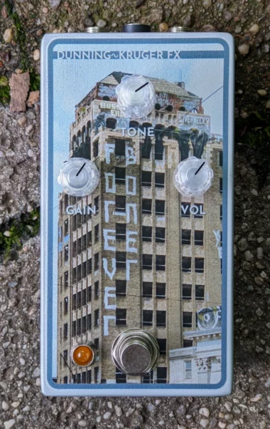 The Forever Boner Pedal, decorated with a photograph of the Buery Building with "Forever Boner" graffiti on it