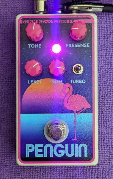 The Penguin pedal, decorated like a Trapper Keeper, inexplicably with a flamingo